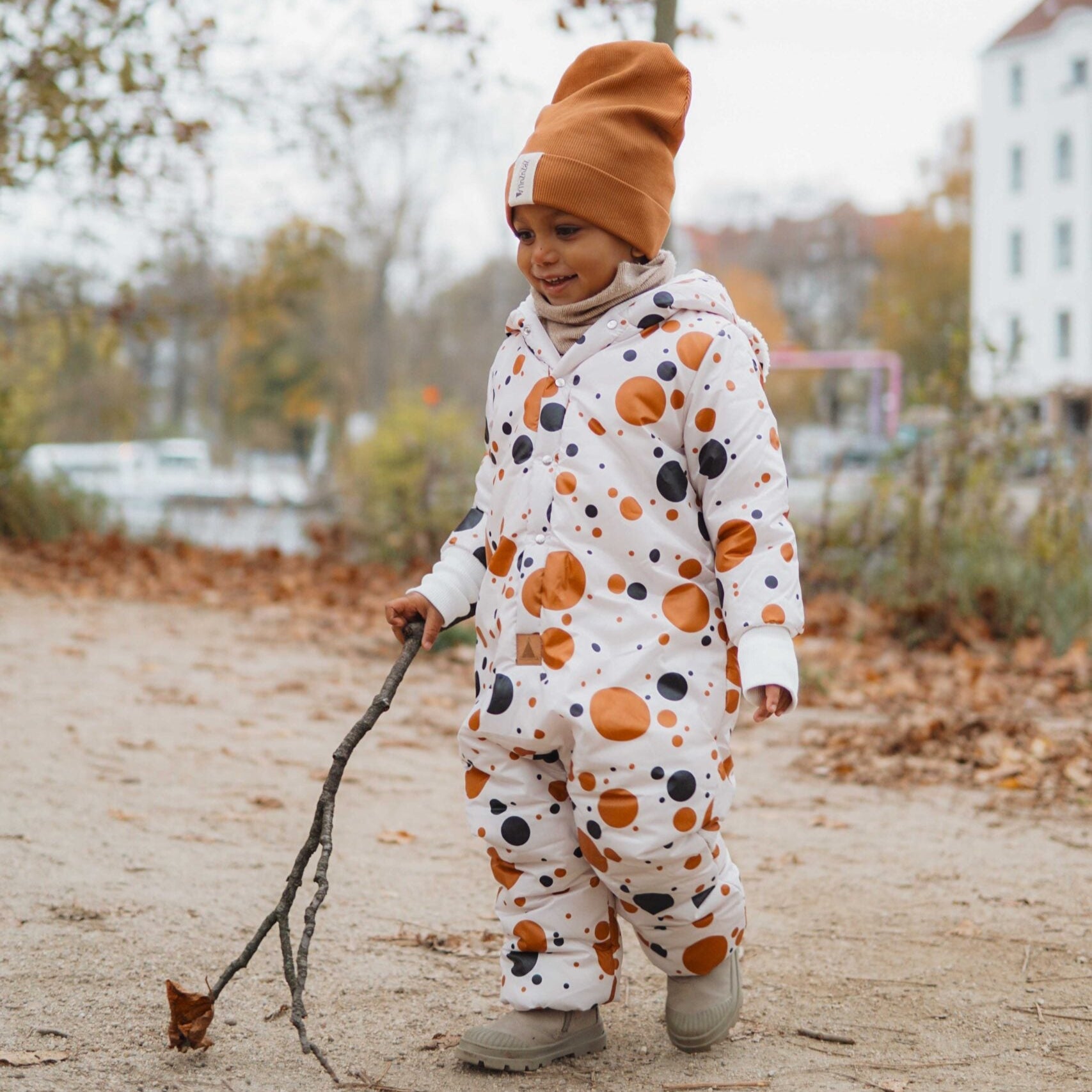 Winter Jumpsuit with Teddy Lining for Babies and Kids - Black and Orange Dots